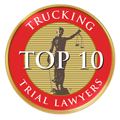 Red and gold badge featuring the words "Trucking Top 10 Trial Lawyers" alongside an image of Lady Justice gracefully holding scales.