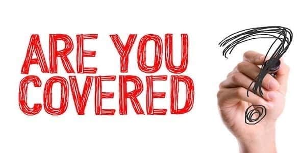 A hand holding a marker confidently draws a question mark next to the red text "ARE YOU COVERED?" on a white background, evoking thoughts of family protection in these uncertain times.
