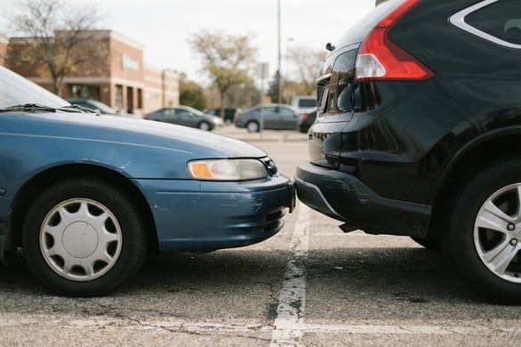 Close-up of a rear-end collision between two vehicles, illustrating a no-fault insurance claim